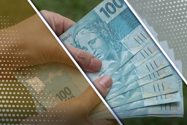 Mãos segurando notas de 100 reais.