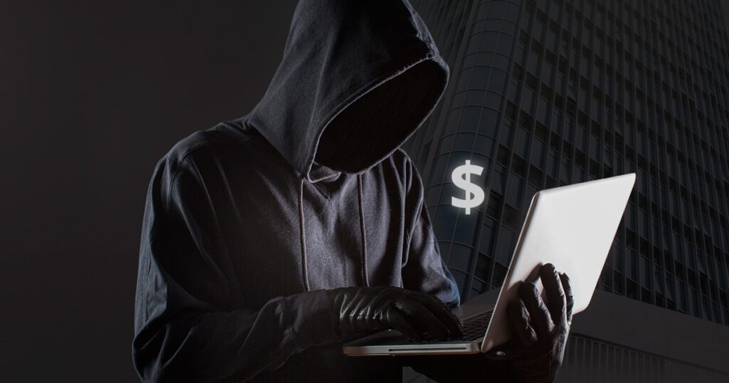 imagem de uma pessoa vestida de criminoso digital para falar da fraude bancária em Portugal.