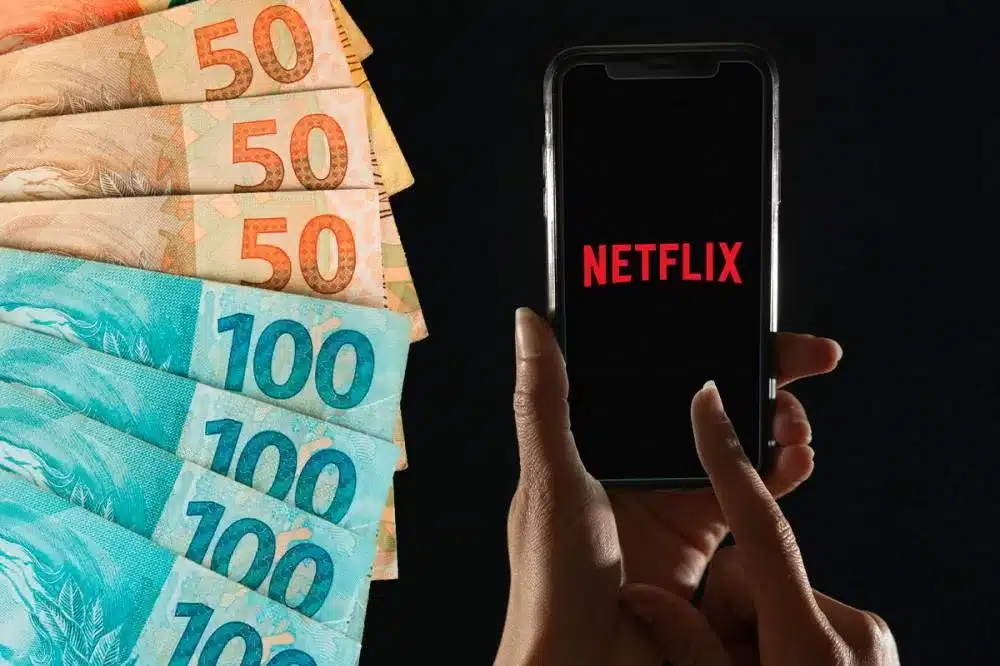 celular aberto na netflix e ao lado de dinheiro