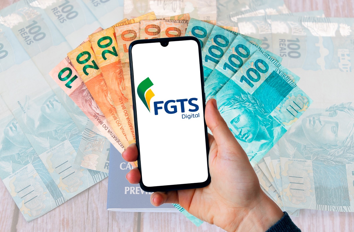 celular aberto no fgts ao lado de muitas cédulas de dinheiro